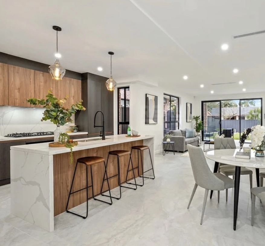 A durable modern kitchen with marble counter tops.