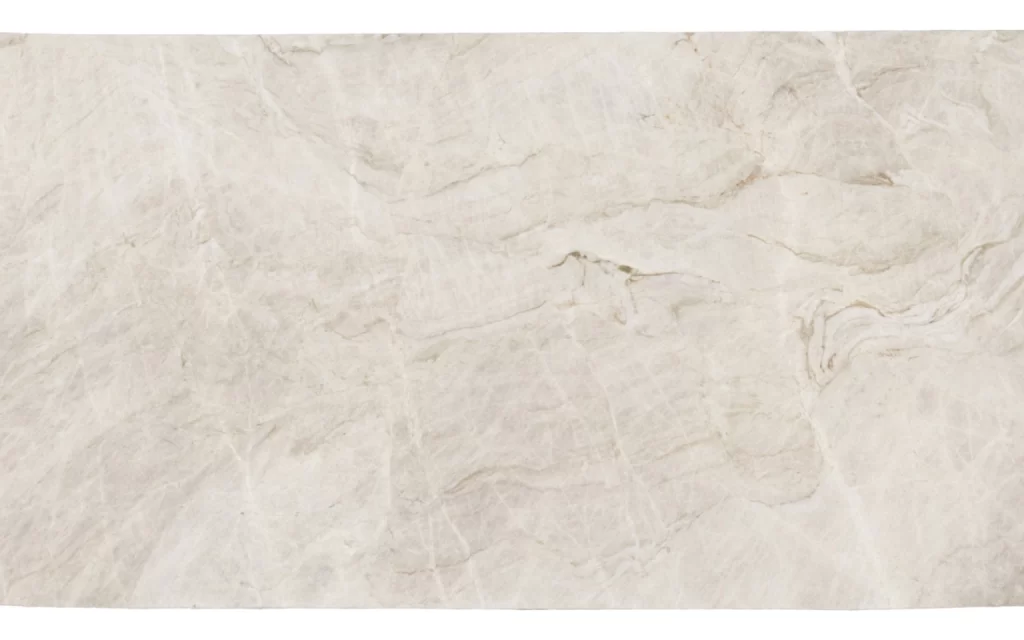 A close-up view of a light beige textured marble surface with subtle veining and natural patterns reminiscent of the elegant marbles used in constructing Block 5 of the Taj Mahal.